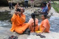 Local tourist taking photos with mobile phone at Ravana falls