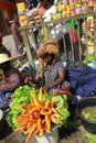 A local trader with a makeshift stall of vegetables at a street market in Accra, Ghana Royalty Free Stock Photo