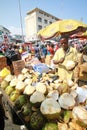 A local trader selling coconuts at a street market in Accra, Ghana Royalty Free Stock Photo