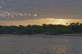 Local traditional River Houses and Buildings built on Stilts on the gently sloping sandy banks of the Amazon River