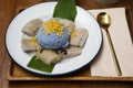 Local traditional thai dessert sweet meal and food fusion snack banana in coconut milk with butterfly Pea ice cream on antique Royalty Free Stock Photo