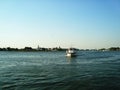 Local transport boat crossing river, Danube Delta, Tulcea