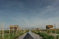 Local transportation on a small boat through a floating village on Inle Lake, Myanmar.Traditional wooden floating houses and Royalty Free Stock Photo