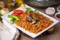 Local Turkish food Lamb on barley noodle. Turkish name Ankara Tava or sehriyeli pilav ustu kuzu incik