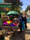 vendor sells colored powder for holi in udaipur in rajasthan, india