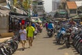 Local Vietnamese people walking on the street near Hoa Binh Market in Ho Chi Minh City, Vietnam