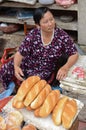 Local Vietnamese woman selling bread