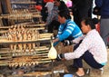 Local Vietnamese women roasting caught fishes