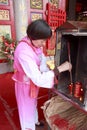 Local villagers burn incense