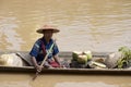 Local waits in boat at the market inla lake