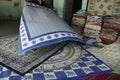 Local weaver displays dhurrie rugs Royalty Free Stock Photo