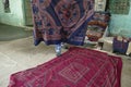 Local weaver displays dhurrie rugs Royalty Free Stock Photo