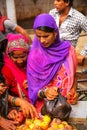 Local woman buying apples at the street market in Fatehpur Sikri, Uttar Pradesh, India. Royalty Free Stock Photo