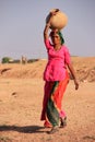 Local woman carrying jar with water on her head, Khichan village Royalty Free Stock Photo