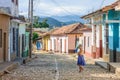 Local woman and colorful houses in Trinidad, Cuba Royalty Free Stock Photo