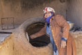 Local woman cooking, Rayen, Iran