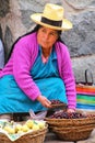 Local woman selling fruits at the street market in Ollantaytambo, Peru Royalty Free Stock Photo