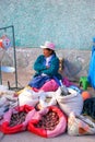 Local woman selling potatoes and grain at the street market in C Royalty Free Stock Photo