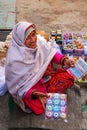 Local woman selling souvenirs in Amber Fort near Jaipur, Rajasthan, India