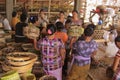 Local women dressed in batik preparing offerings for a coming festivity