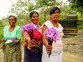 Local women selling flowers at Dambulla Golden Temple in Sri Lan