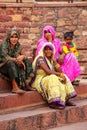 Local women sitting on the steps outside Jama Masjid in Fatehpur Sikri, Uttar Pradesh, India