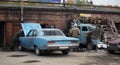 Local wreck yard with american cars Plymouth Belvedere 1970 and dodge 1939 Royalty Free Stock Photo