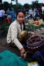 local young woman selling birds at the village market