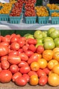 fresh picked tomatoes on table outside at farmers market Royalty Free Stock Photo