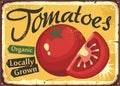 Locally grown red tomatoes on yellow background vintage metal sign