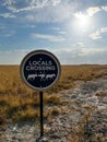 Locals crossing joke road sign in African savannah. Desert landscape. Royalty Free Stock Photo