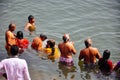 Locals dip in the Ganges River in Varanasi, India. Royalty Free Stock Photo