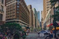 Locals enjoying a early summer day in Garment District Urban Garden un Broadway inbetween skyscrapers of Manhattan