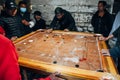 Locals having a game of Carrom Board in Paro, Bhutan.