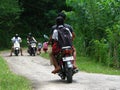 Locals Meeting Tourists On Motorbikes In Countryside