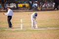 Locals play cricket in the park