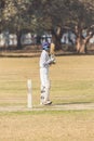 Locals play cricket in the park