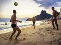 Locals Playing Ball at Sunset in Ipanema beach, Rio de Janeiro, Brazil