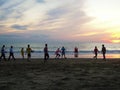 Locals playing football at the beach