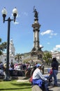 Locals relax in the square in front of Carondelet Palace in historic centre of Quito