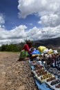 Locals sell souvenirs at the ruins of saqsaywaman, Cusco. Peru Royalty Free Stock Photo