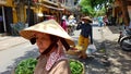 Locals on street in Hoi An Vietnam Royalty Free Stock Photo