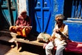 A locals talk in a alley in Varanasi, India.