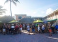 Locals and tourists enjoy outdoors at the Hollywood Beach promenade in South Florida