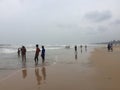 Locals and tourists enjoying in a beach at Kunoor