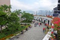 Tourists enjoying their time at Hong Kong Clock Tower garden in Tsim Sha Tsui, Kowloon Royalty Free Stock Photo