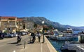 Locals and tourists walking along the shoreline on a beautiful sunny summer day in the town of Korcula, on Korcula island,Croatia.