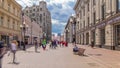 Locals and tourists walking on famous pedestrian Arbat Street timelapse hyperlapse in Moscow, Russia. People sitting on
