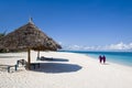 Locals walking on beach in zanzibar Royalty Free Stock Photo