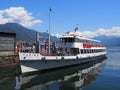 Paddle-wheel steam boat moored ready to cruise at promenade on alpine Maggiore Lake in Locarno at Switzerland